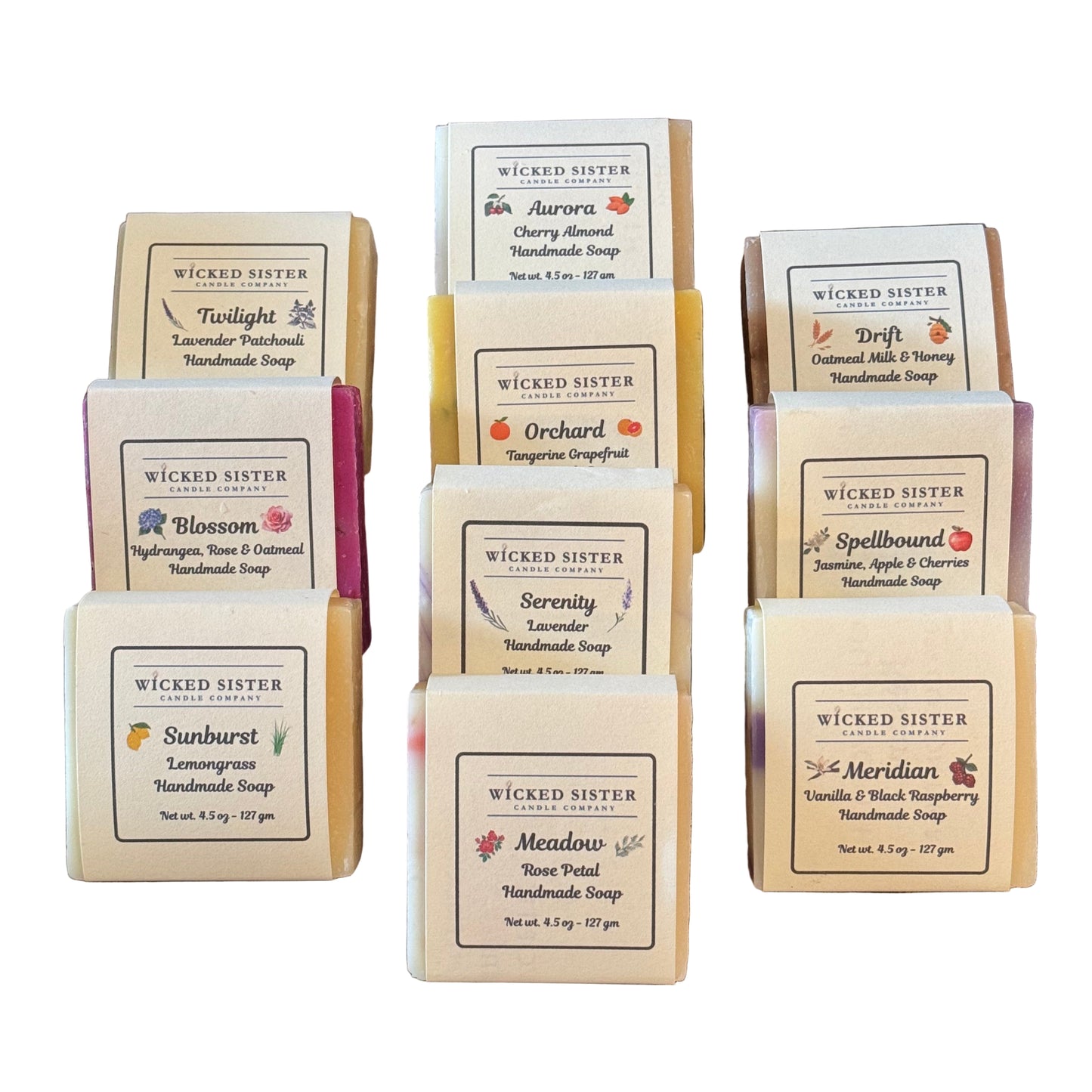 Collection of Wicked Sister soap bars with labels on a wooden surface
