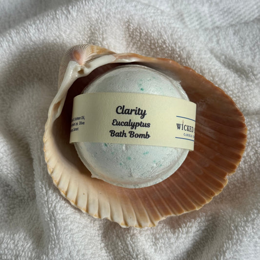 Bath bomb in a shell with a label on a textured surface