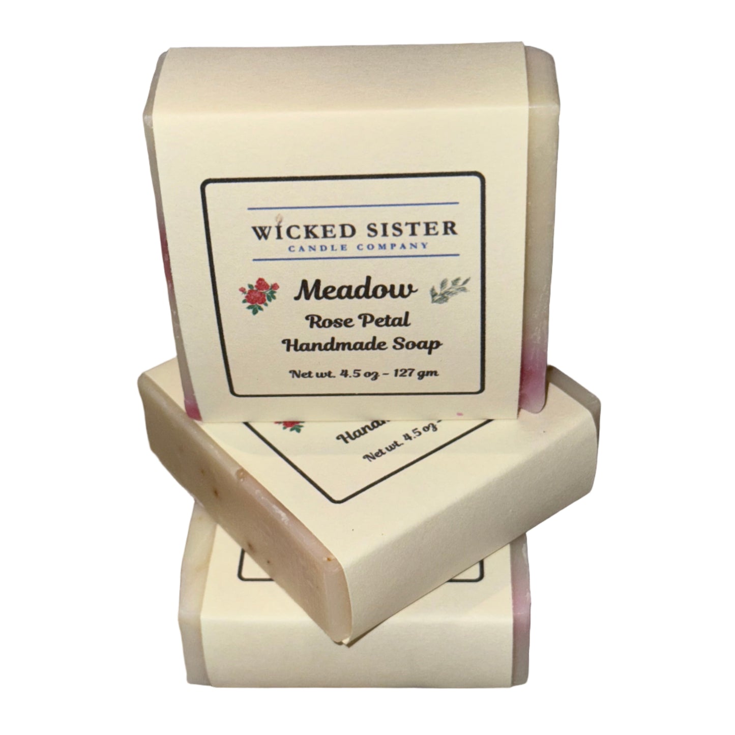 Three bars of soap on a white countertop with 'Wicked Sister' branding.