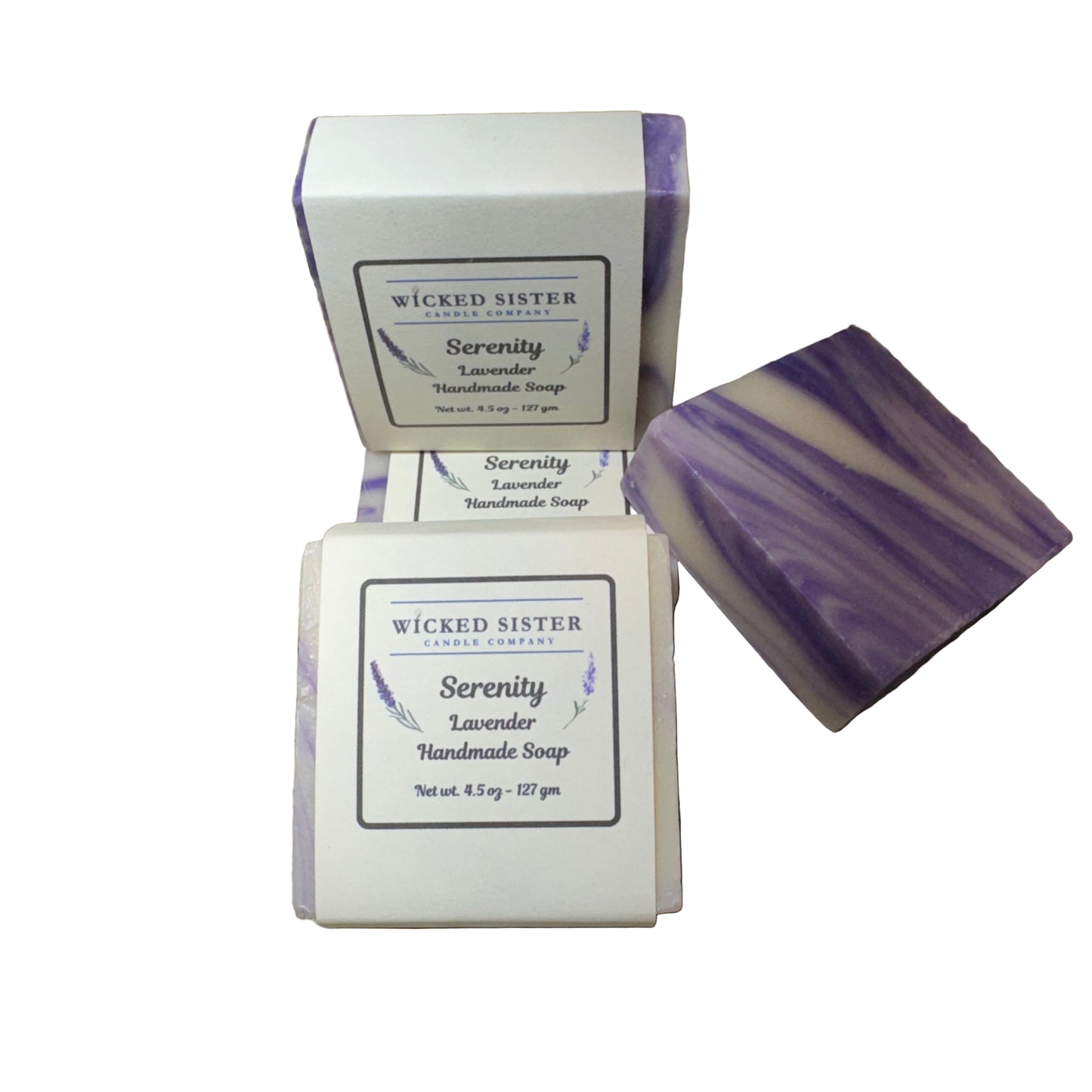 Two bars of Wicked Sister Serenity Lavender handmade soap on a white background.