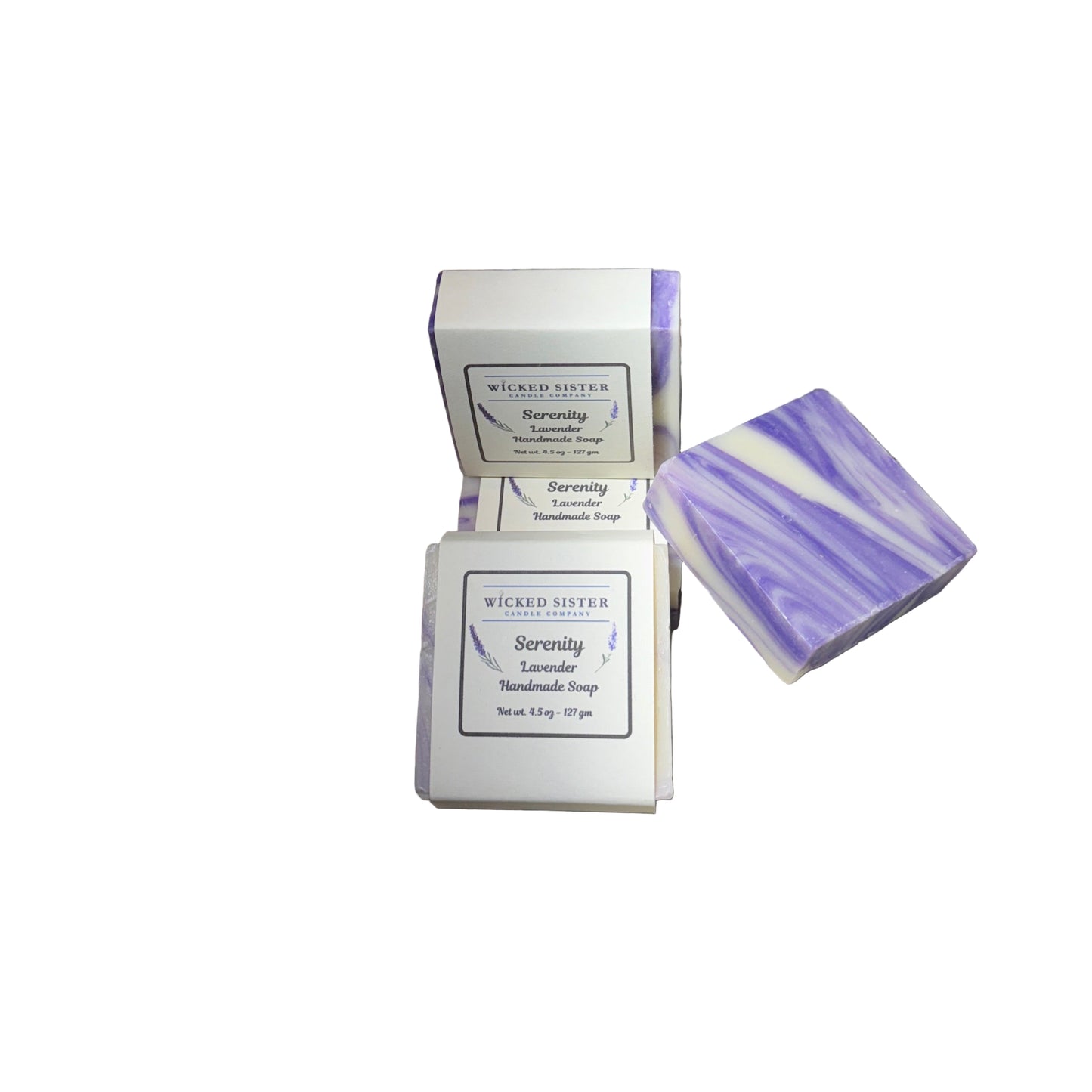 Two bars of lavender soap with packaging on a white countertop