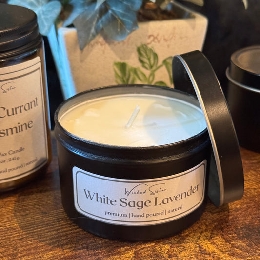 Premium candle with a wicked sister label on a wooden surface