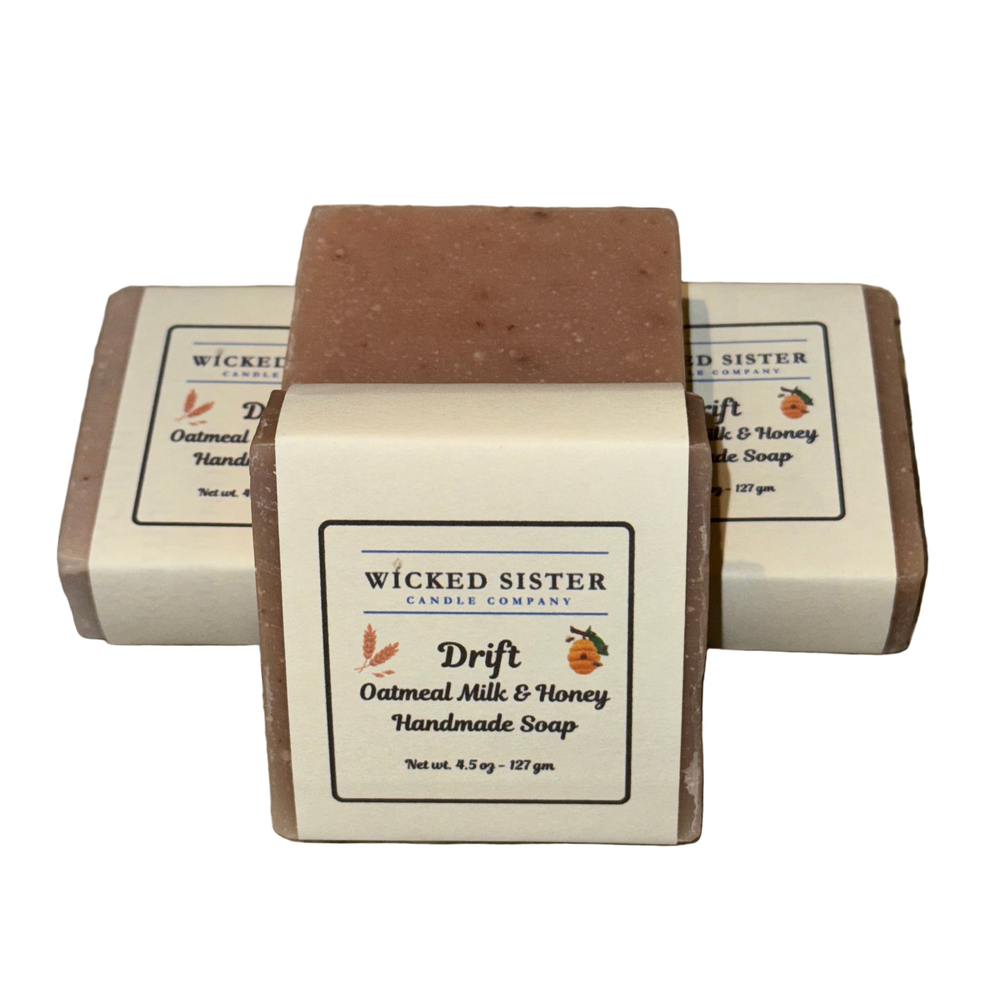 Three bars of oatmeal soap with 'Wicked Sister' packaging on a white background