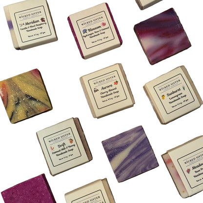 Assorted soap bars with visible brand name on a white background