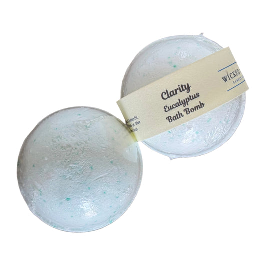 Two eucalyptus bath bombs with a label on a white surface