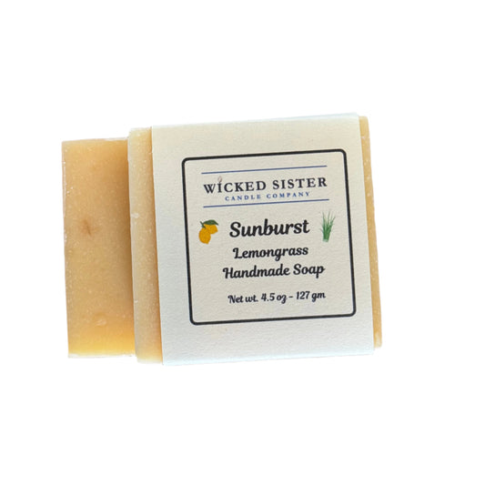 Handmade soap bar with a Wicked Sister Candle Company label on a white surface