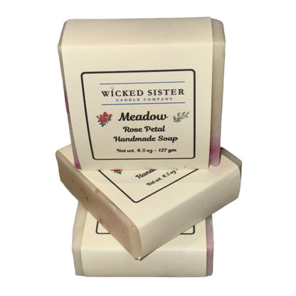 Three bars of soap on a white countertop with 'Wicked Sister' branding.